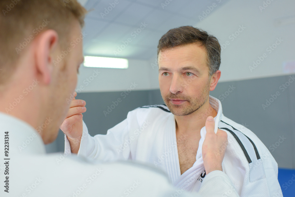Fototapeta premium Two men practicing judo moves