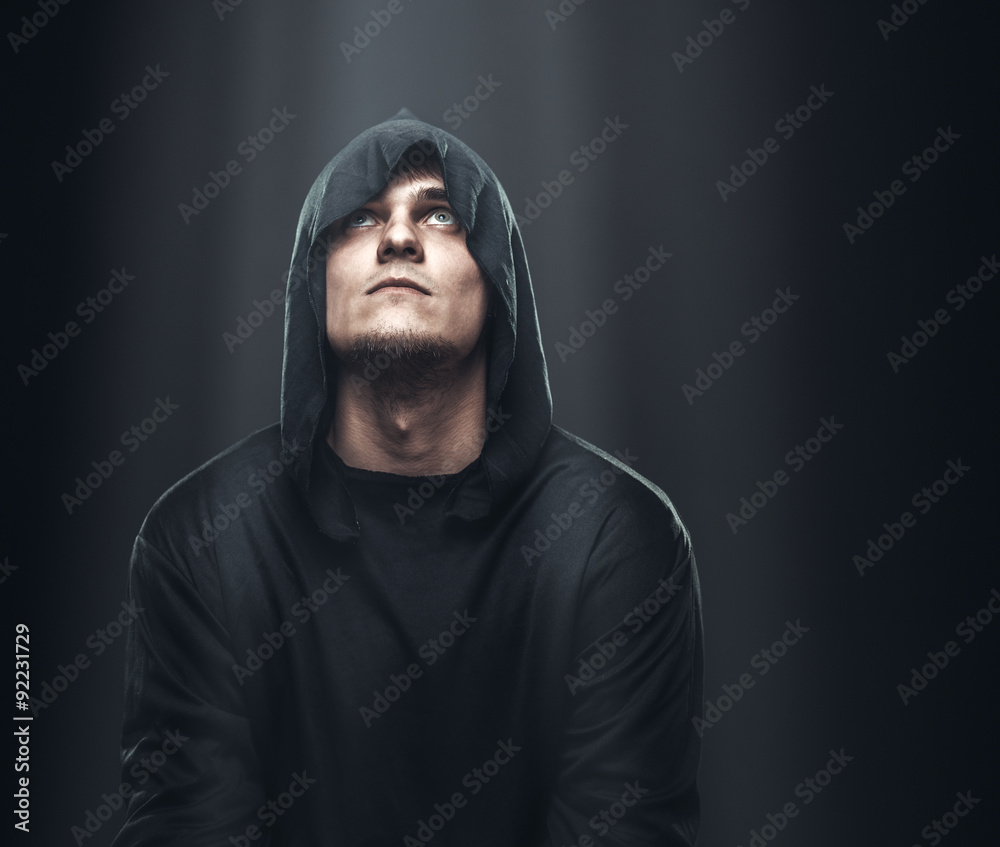 guy a black robe standing in dark guy a black robe standing in dark