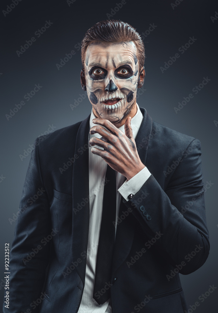 Surprised businessman with a makeup skeleton Surprised businessman with a makeup skeleton