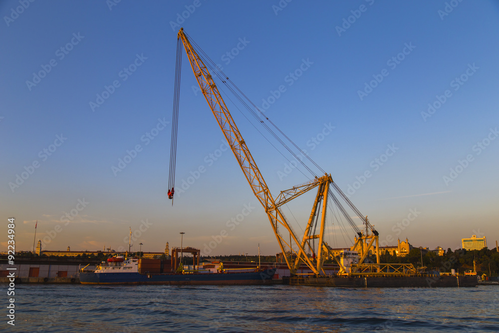 Crane, port and sunset