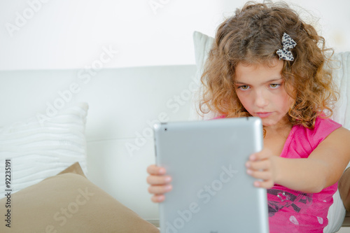 Little girl using a tablet computer