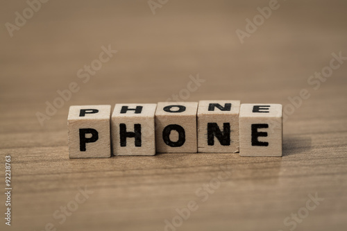 phone in wooden cubes