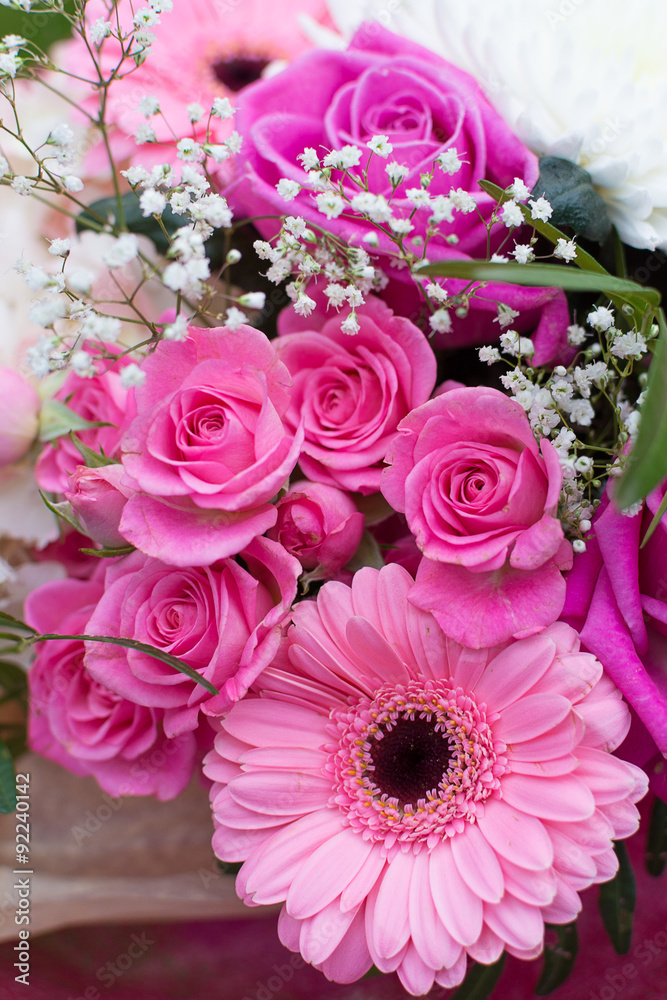 Gorgeous bouquet with pink roses and daysies (Gerbera) and white Chrysanthemum flowers on grass