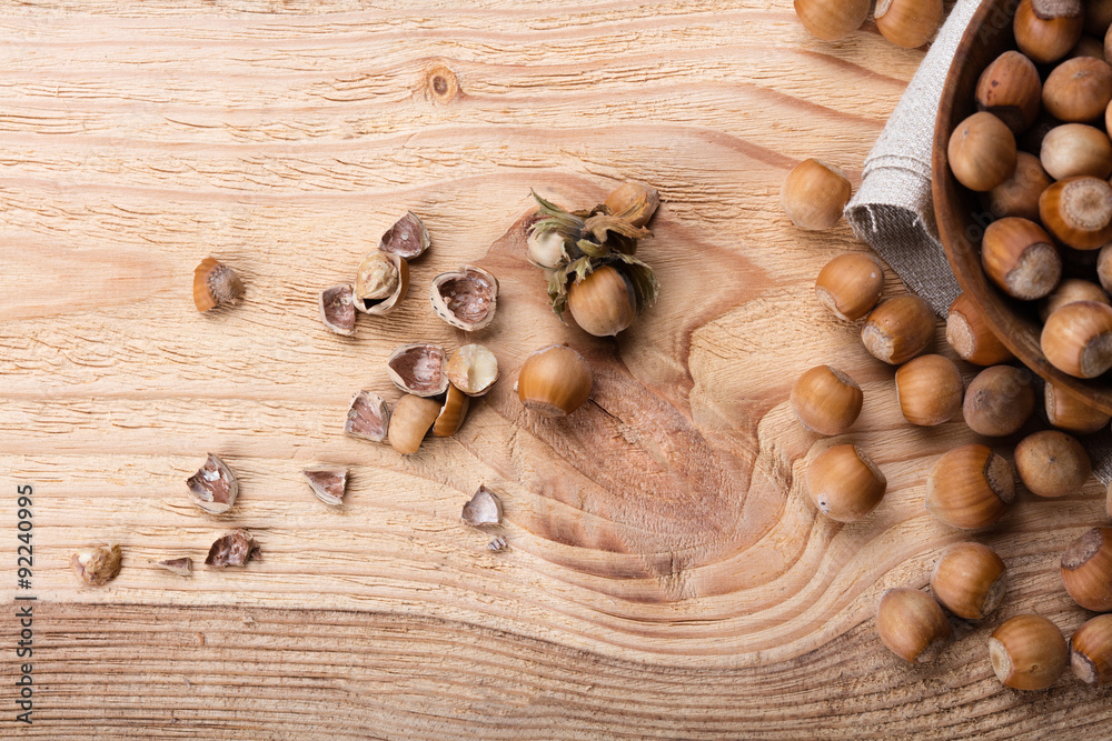 Hazelnuts on wooden table Hazelnuts on wooden table