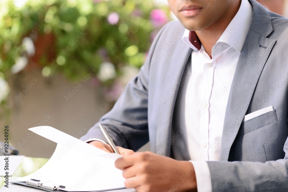 © zinkevych - Handsome businessman making notes © zinkevych - Handsome businessman making notes