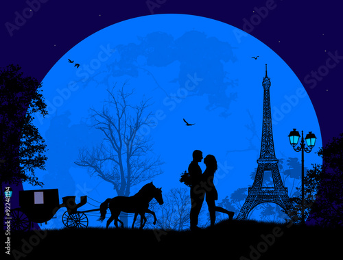 Carriage and lovers at night in Paris