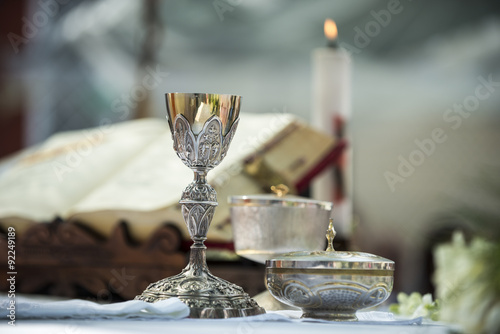 Chalice and ritual objects used for catholic mass photo