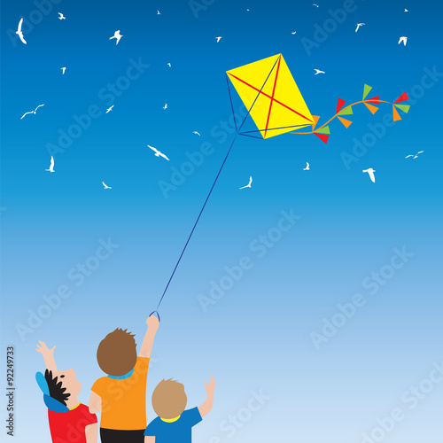 Children with a kite and birds in the sky.
