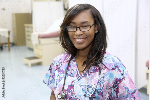 Young attractive female healthcare professional in hospital examination room