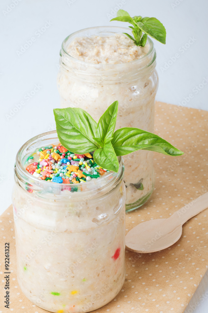Oatmeal in glass cans with sprinkles and herbs Oatmeal in glass cans with sprinkles and herbs