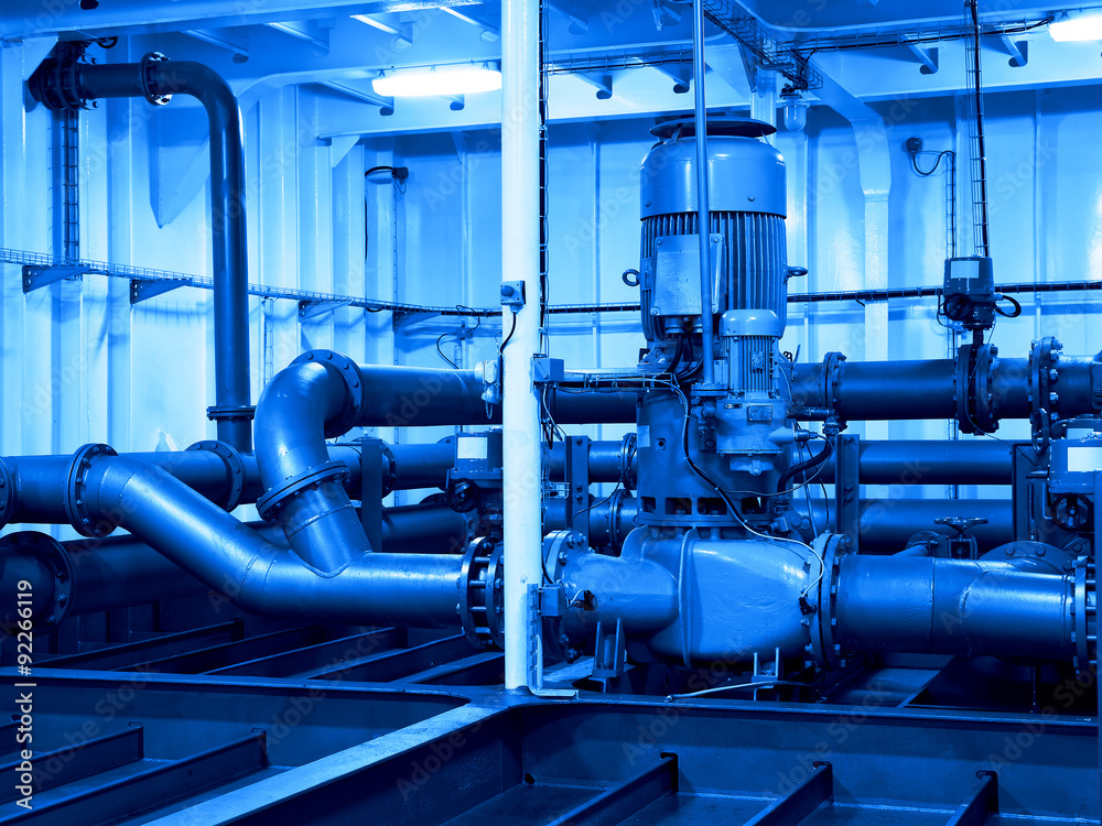 Industrial electric water pump and pipes - industry concept.