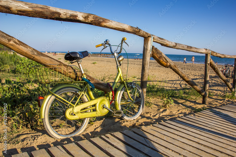 Fototapeta premium Nice retro vintage bicycle near beach, sunny day