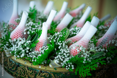 Fototapeta Naklejka Na Ścianę i Meble -  Rose flowers in Foam Sleeve Protect arrangement in antique tray
