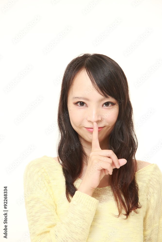 young Japanese woman whith silence gestures young Japanese woman whith silence gestures