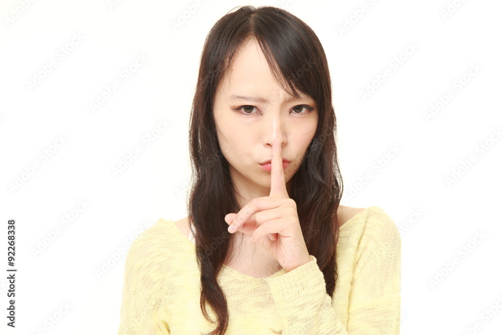 young Japanese woman whith silence gestures young Japanese woman whith silence gestures