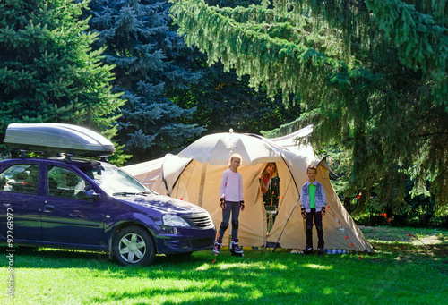 Family summer vacation with tent.