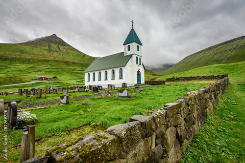 Small village church with cemetery in Gjogv, Faroe Islands, Denm photo
