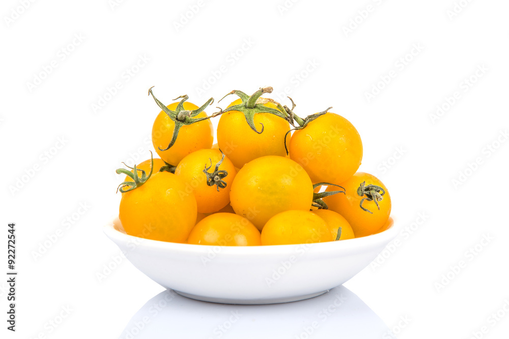 Mini yellow cherry tomato over white background Mini yellow cherry tomato over white background