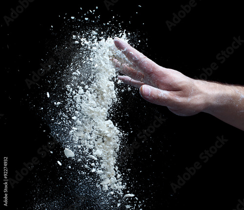 the man's hand and a handful of flour