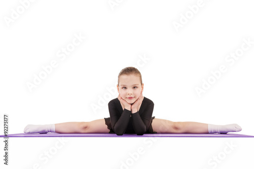 Little girl sitting on the splits