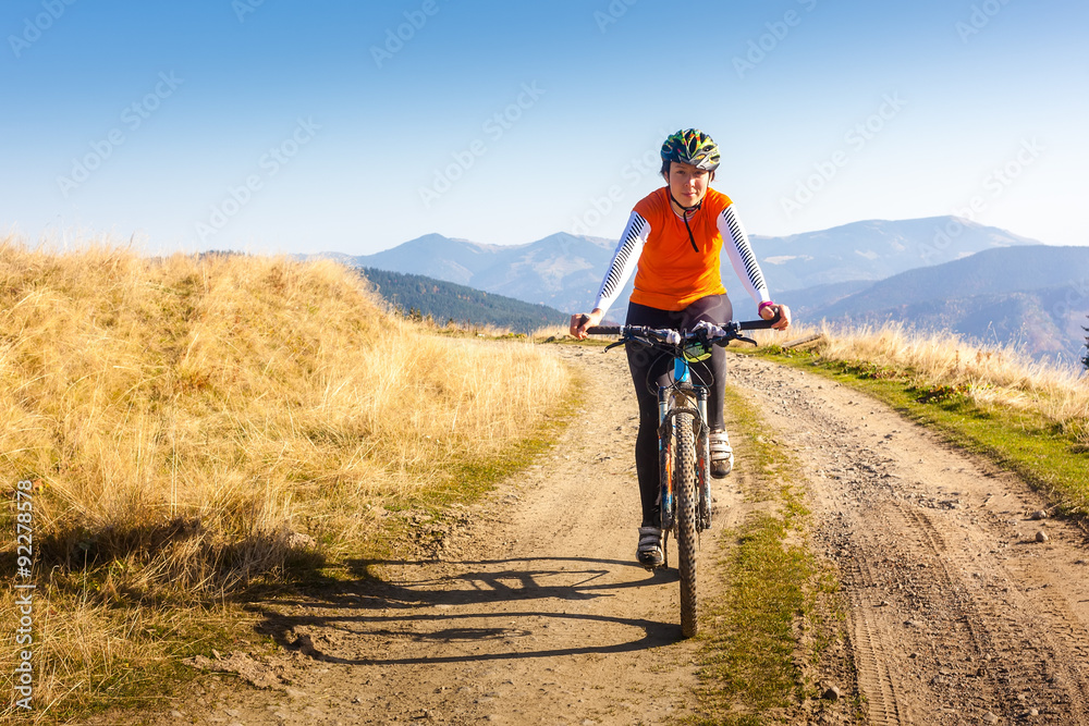 Biker riding in autumn mountains