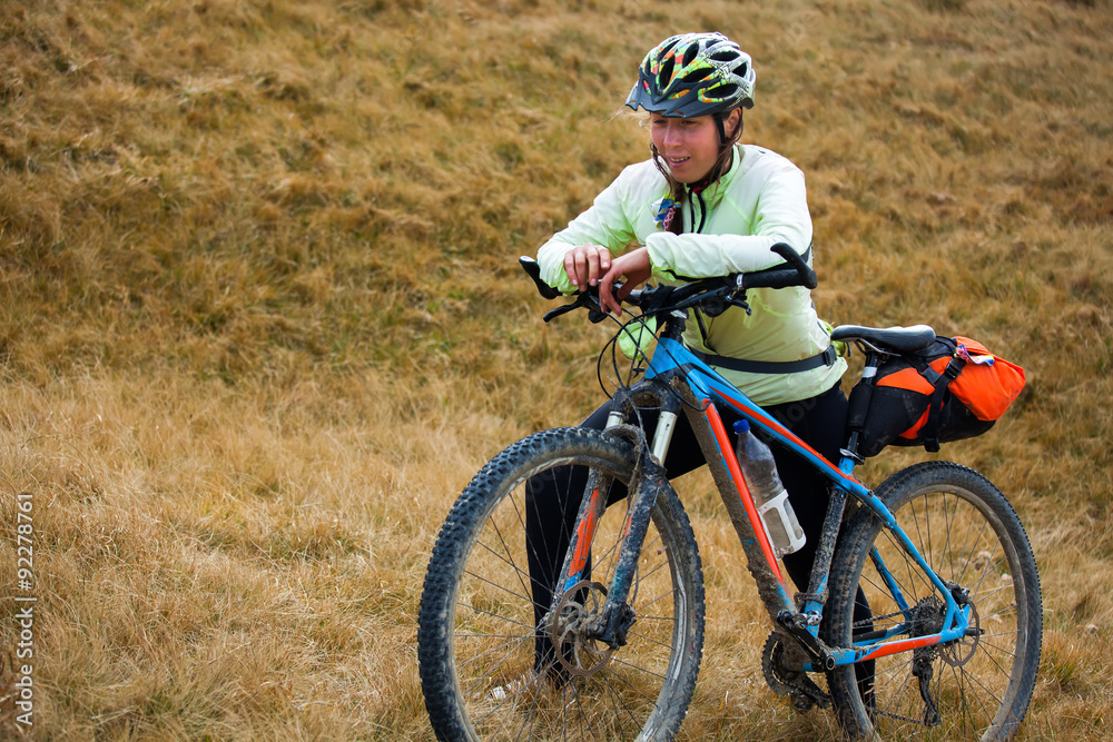 Biker riding in autumn mountains