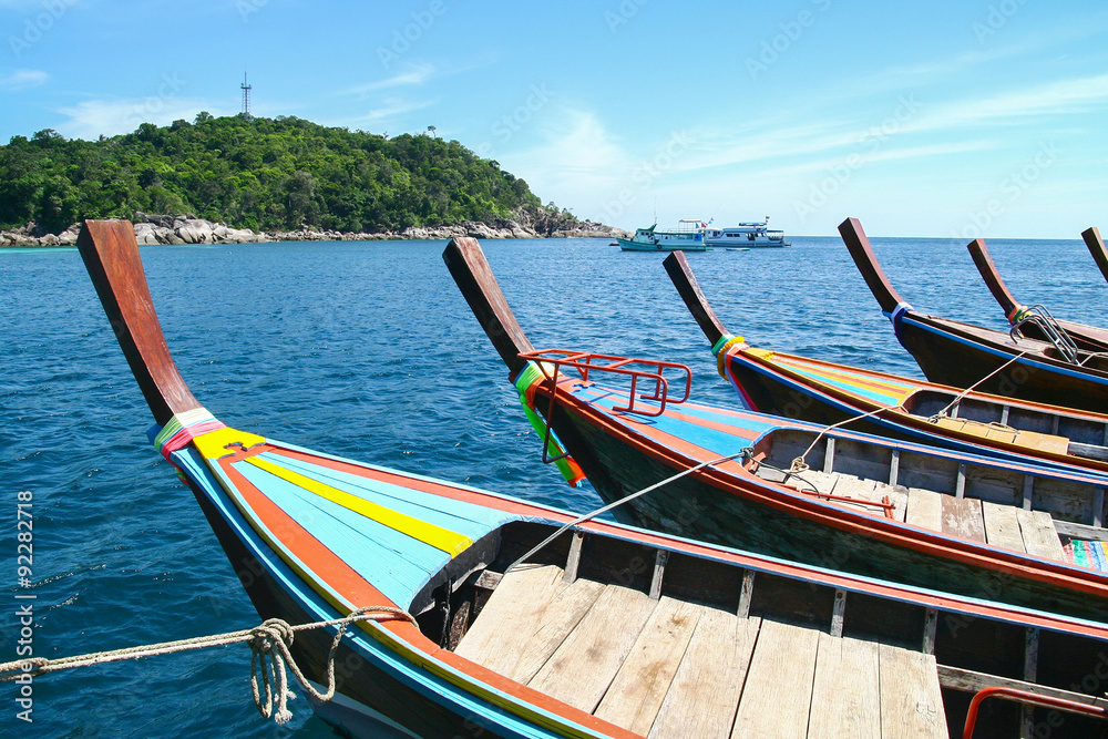 Line of long tail boat Ruea Hang Yao tied together in the middle