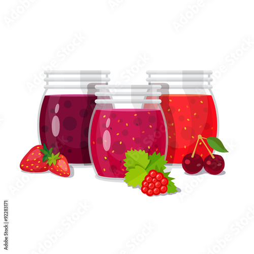 Three glass jars of jam with berries