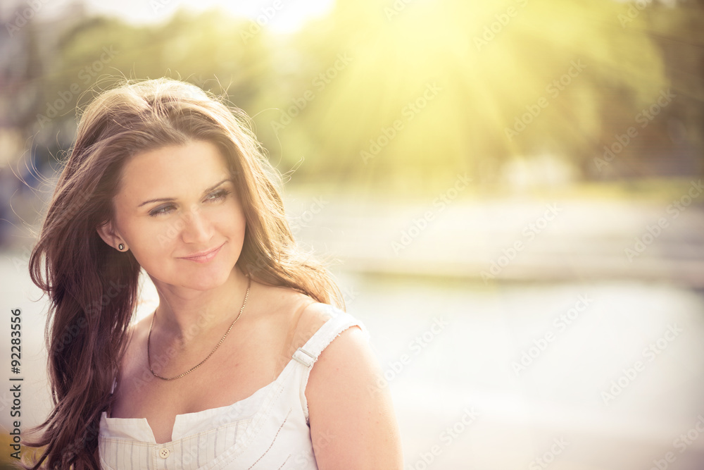 Portrait of a beautiful european woman smiling outdoors