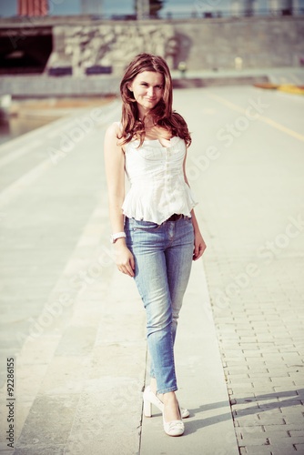 Portrait of a beautiful european woman smiling outdoors © Valeri Luzina