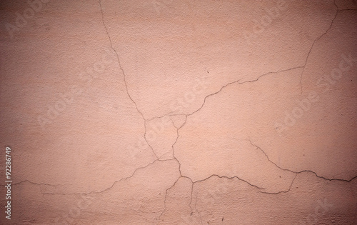 Texture of old wall covered with pink stucco