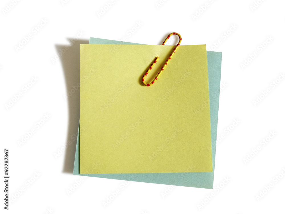 Two blank notes with a colored clip Two blank notes with a colored clip