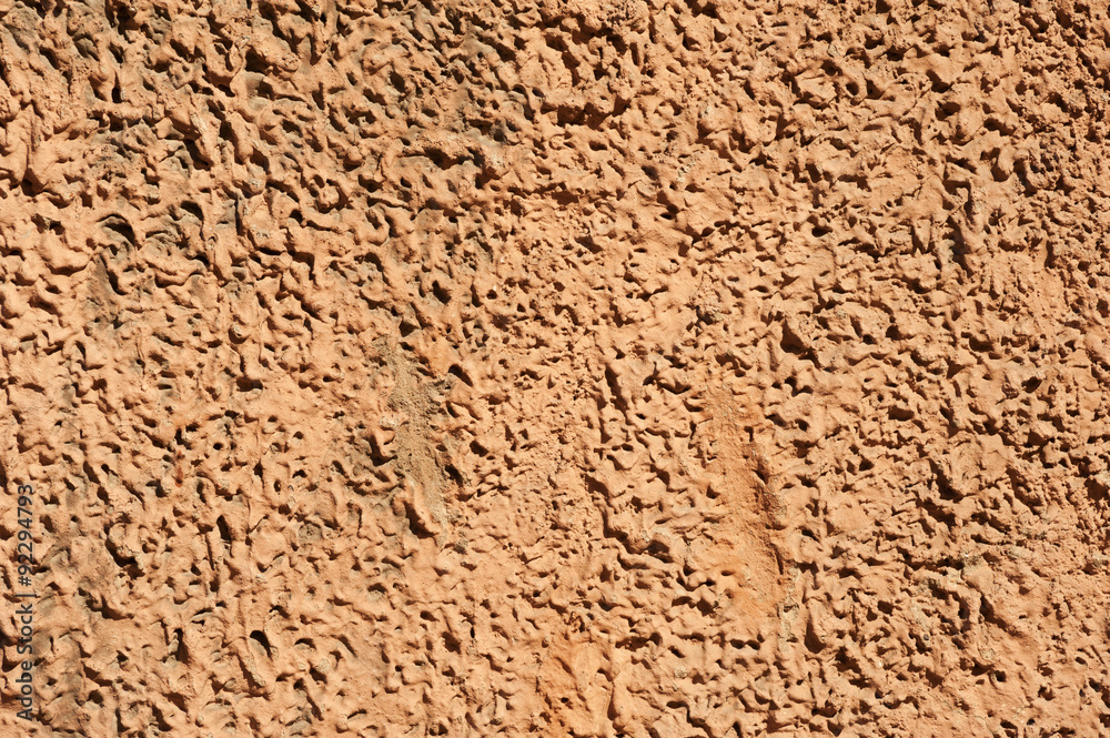Texture of old wall covered with brown stucco Texture of old wall covered with brown stucco