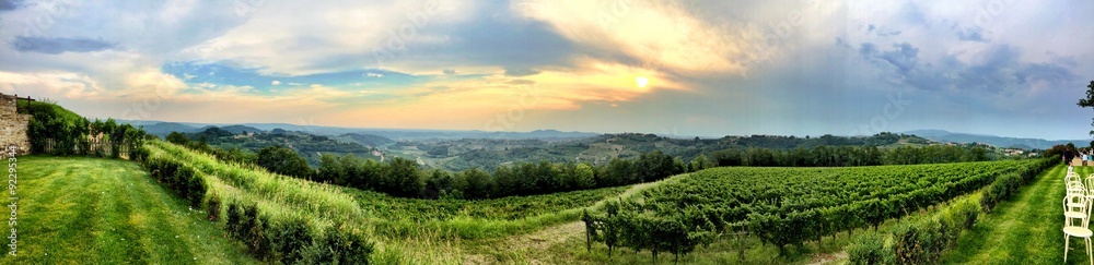 Awesome italian of a green field at the sunset