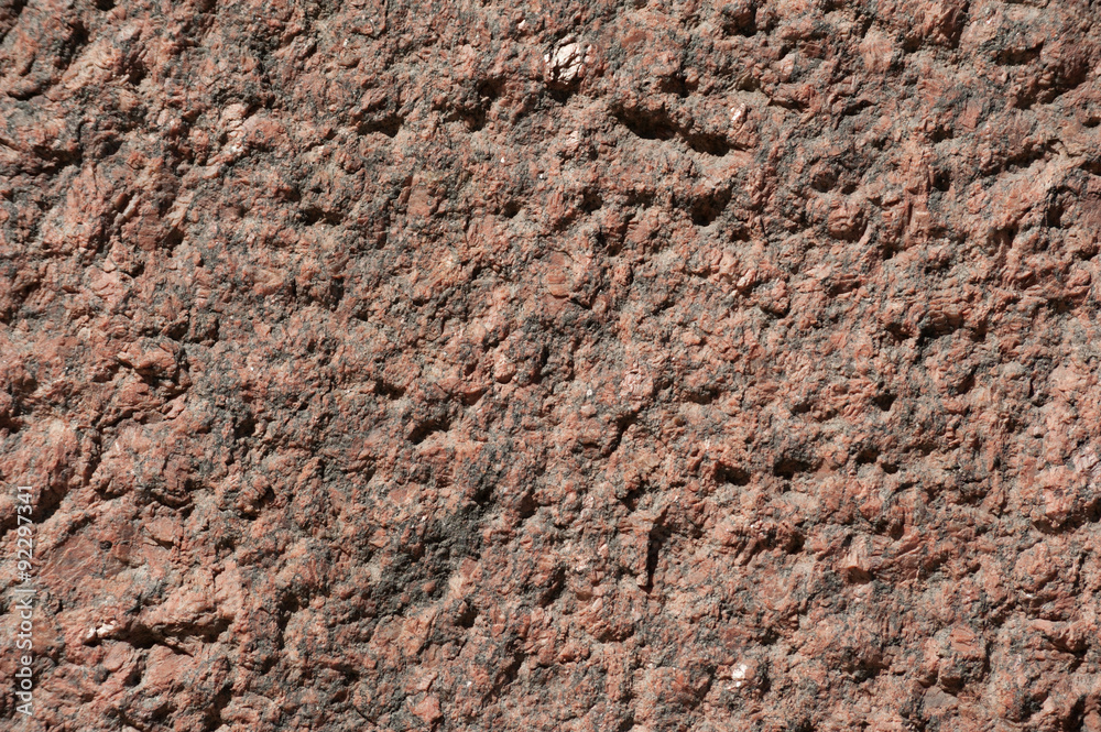 Texture of wall of polished pink granite Texture of wall of polished pink granite