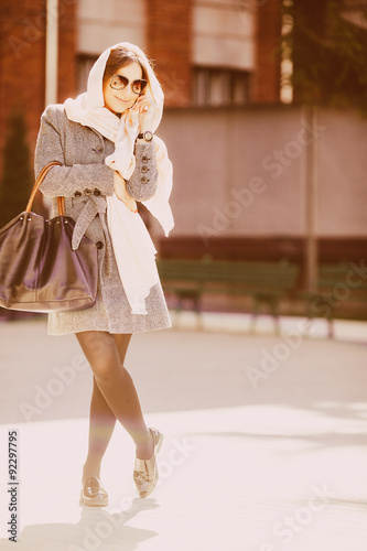 girl in a coat on the street © teksomolika