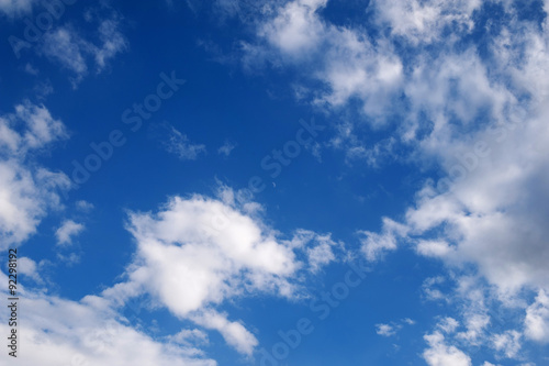 Texture of blue sky with clouds and new moon