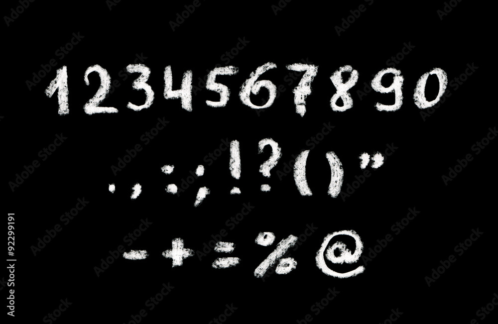 Chalk hand written numbers and punctuation marks on black board Chalk hand written numbers and punctuation marks on black board