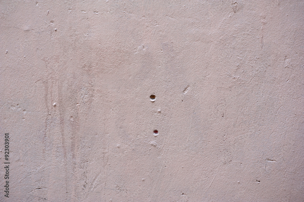 Texture of old wall covered with pink stucco Texture of old wall covered with pink stucco