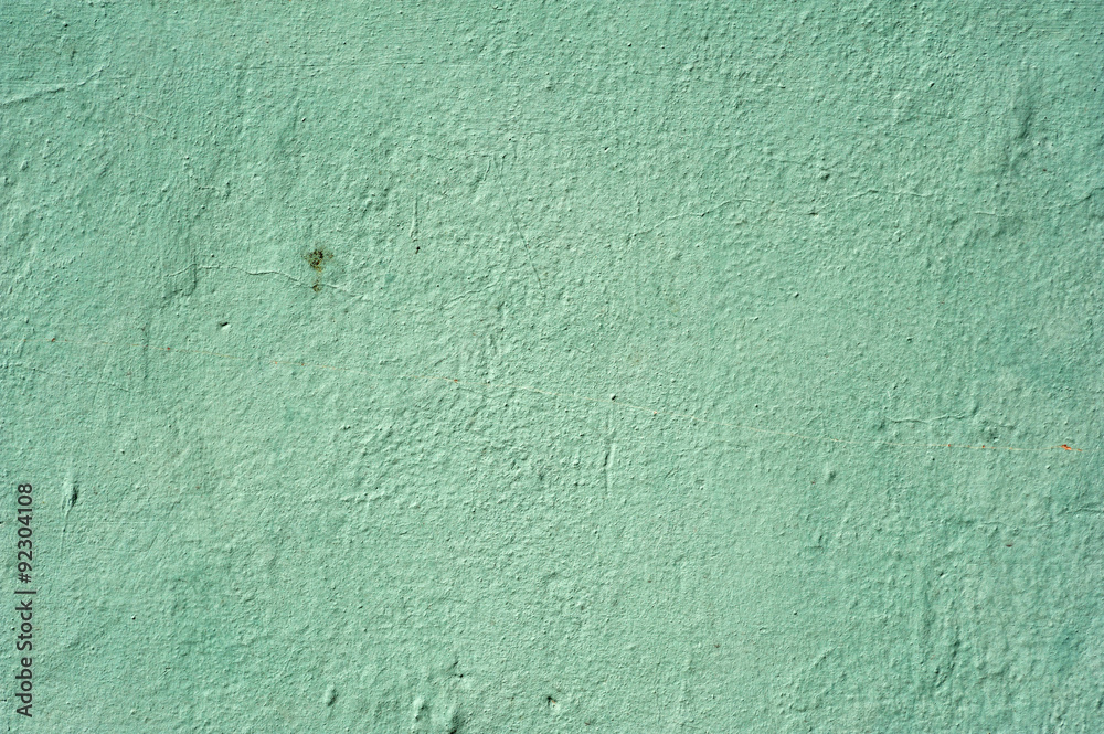 Texture of old wall covered with green stucco