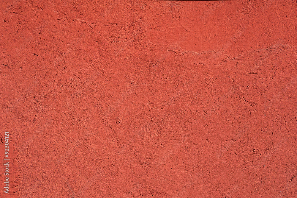 Texture of old wall covered with red stucco Texture of old wall covered with red stucco