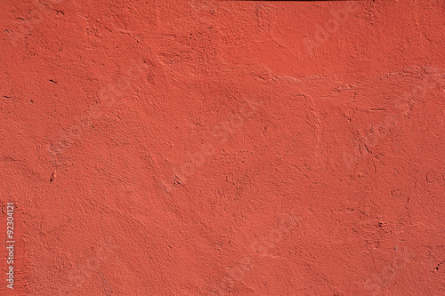 Texture of old wall covered with red stucco