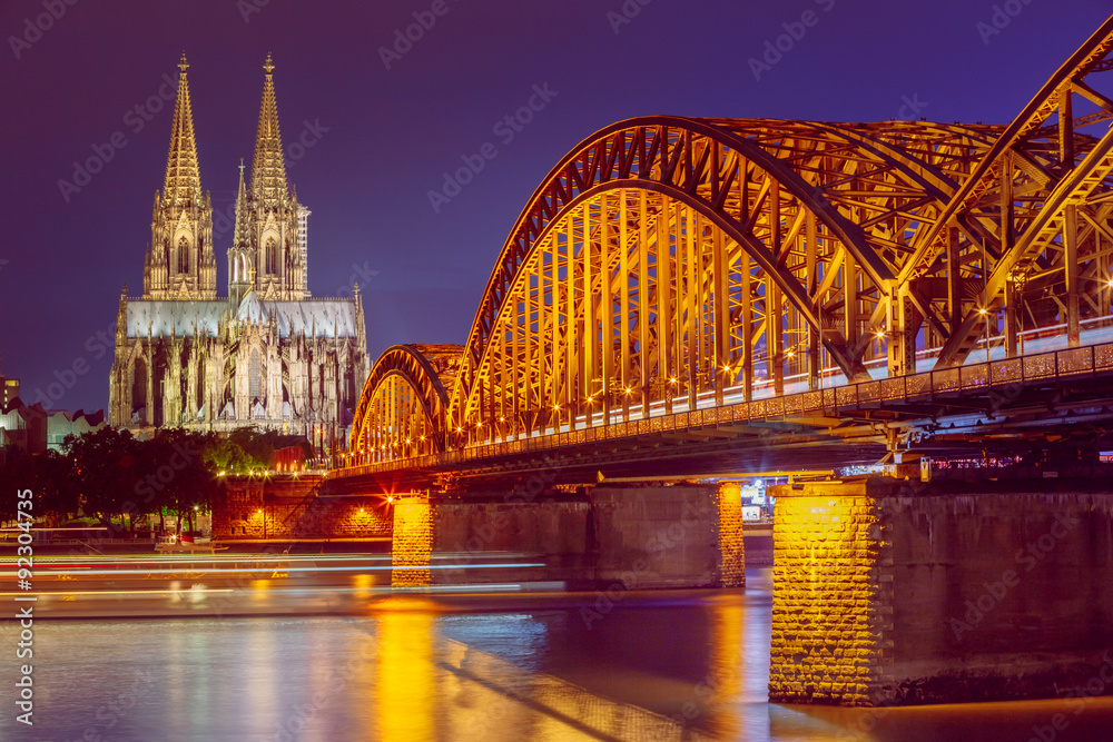 Naklejka premium Night View Of Cologne Cathedral And Hohenzollern Bridge, Germany