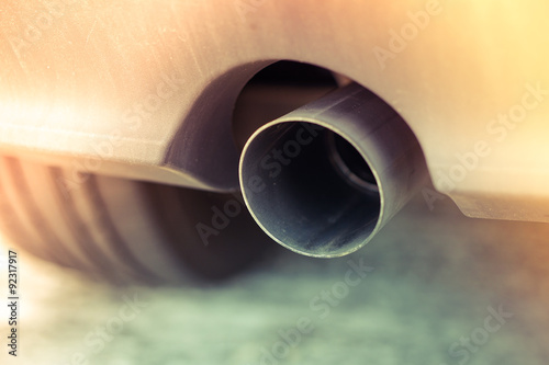 Car pipe exhaust muffler rejecting carbon dioxide, slide leak vintage style © nbnserge
