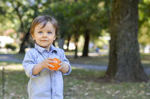 Adorable one year old child in the park