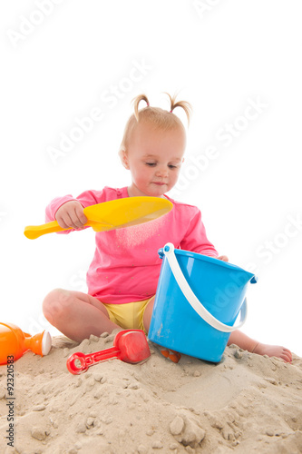 Little toddler playing in the sand