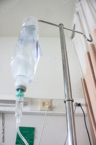 iv bag hanging on a metal pole