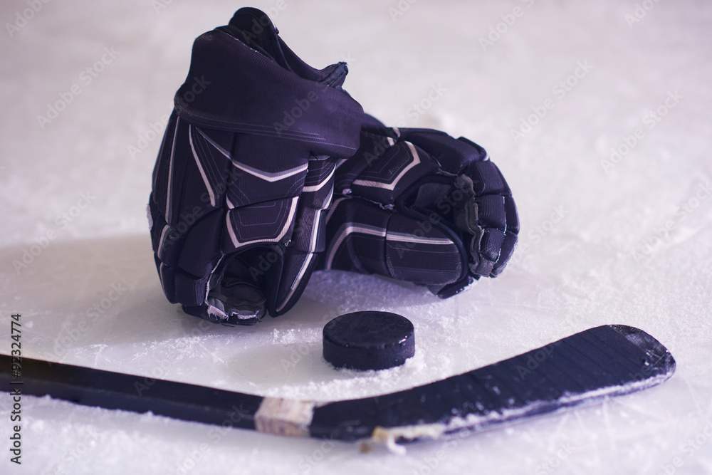 Fototapeta premium hockey sticsk and puck on ice