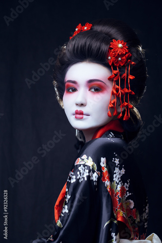 Tablou canvas young pretty geisha in kimono with sakura and decoration
