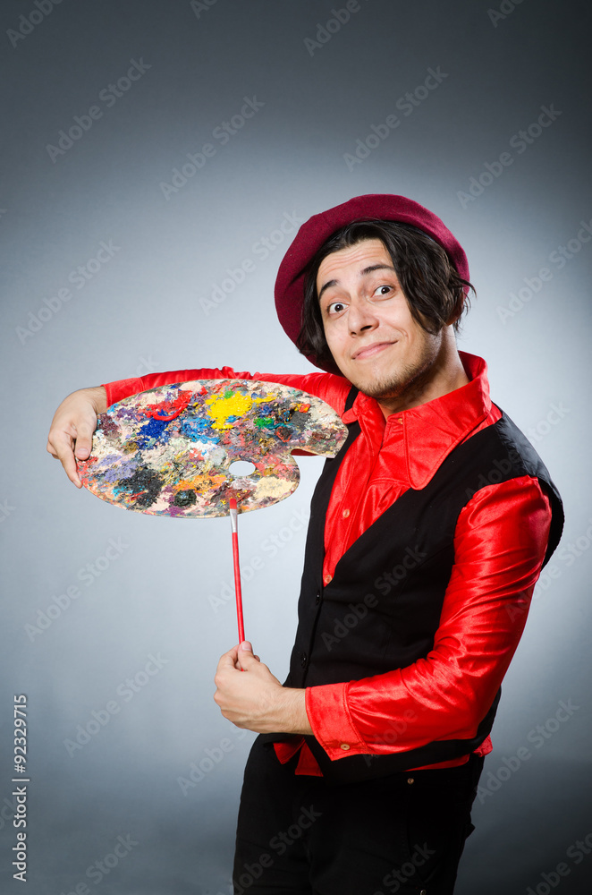 Fototapeta premium Funny artist in dark studio